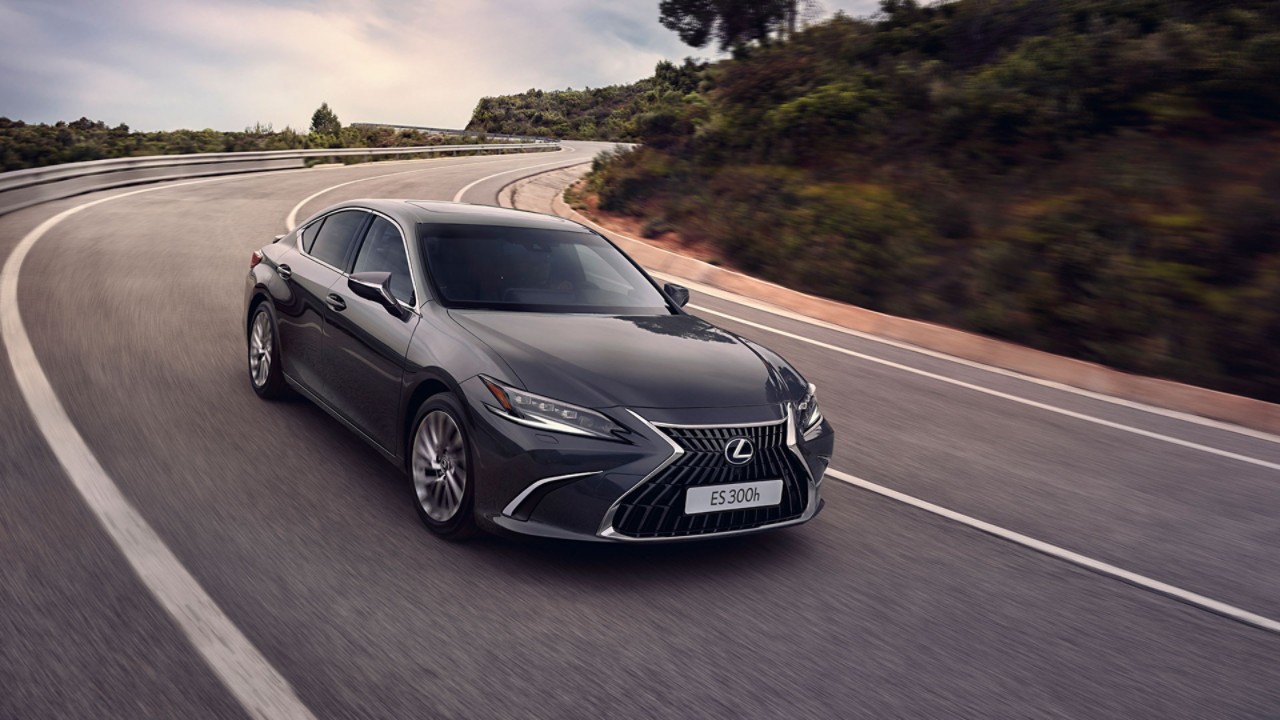 Lexus ES driving on a hillside road